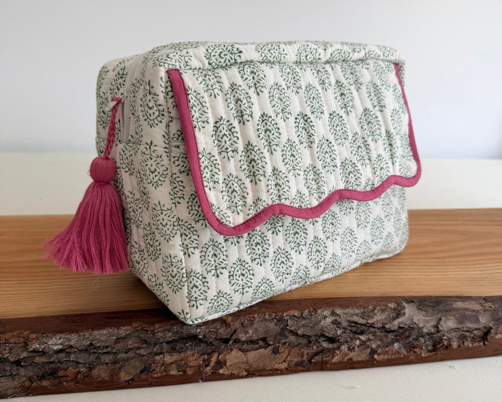 Green washbag with scalloped edging