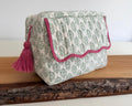 Green washbag with scalloped edging