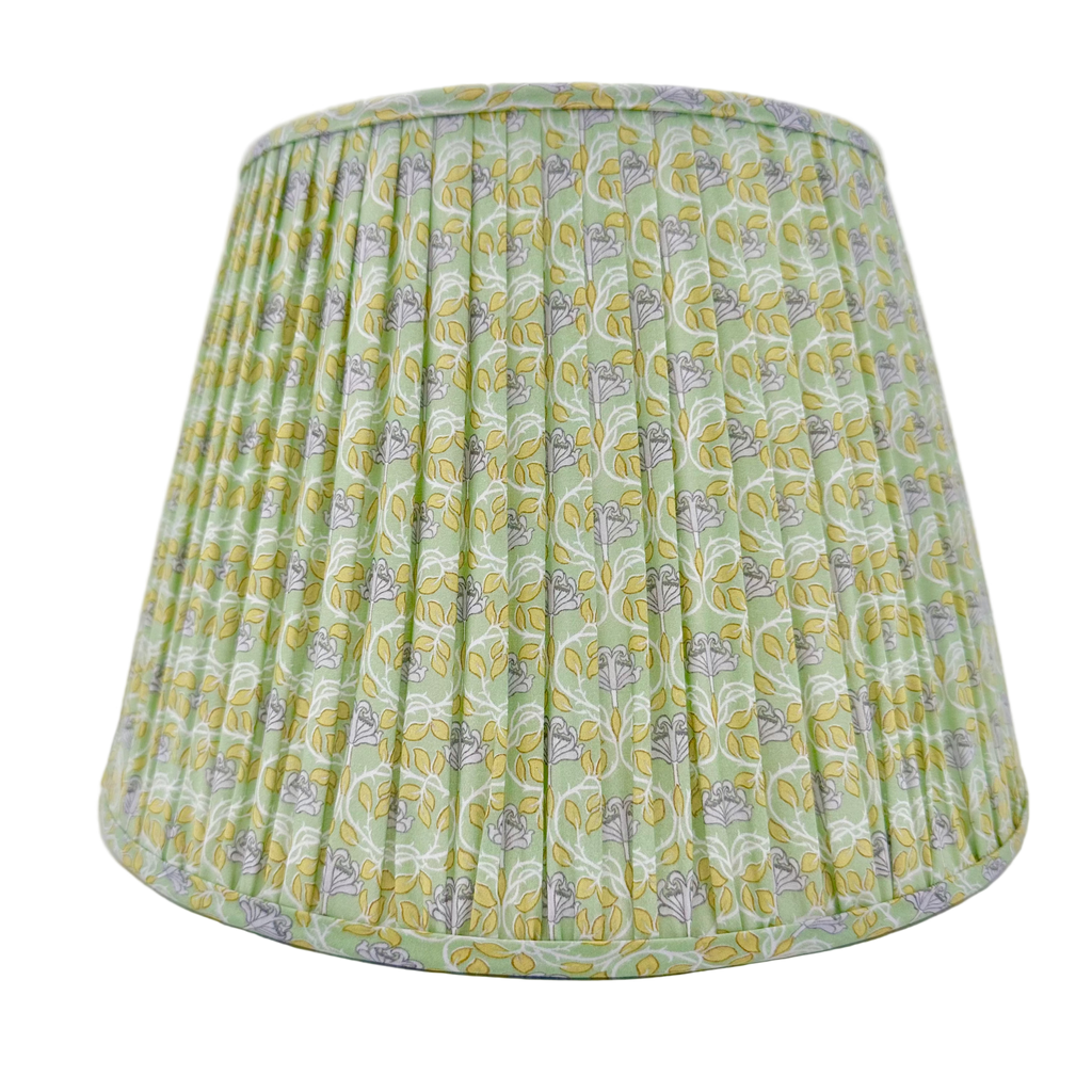 Green patterned lampshade on a white background