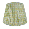 Green patterned lampshade on a white background